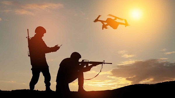 soldiers working with drone