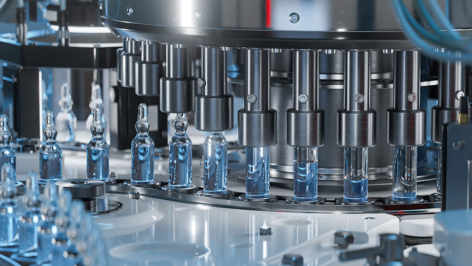 Close-up of Medical Ampoule Production Line at Modern Modern Pharmaceutical Factory. Glass Ampoules are being Filled. Medication Manufacturing Process.