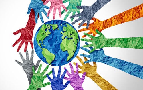 Diverse hands around globe