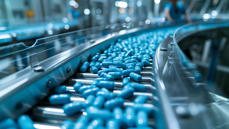 Conveyor belt with blue capsules medicine